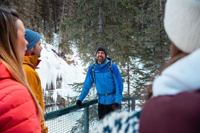 Banff: Morning or Afternoon Johnston Canyon Icewalk - Fitting the cleats before the trail