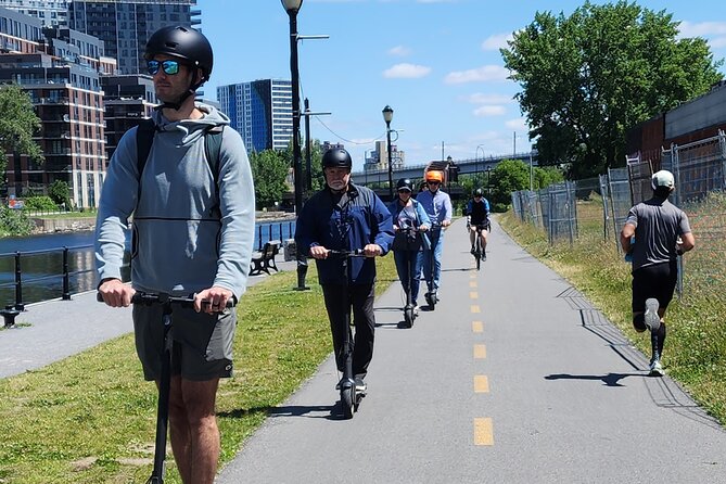 Experience Old Montreal on e-scooters with a local comedian - Following the Lachine Canal