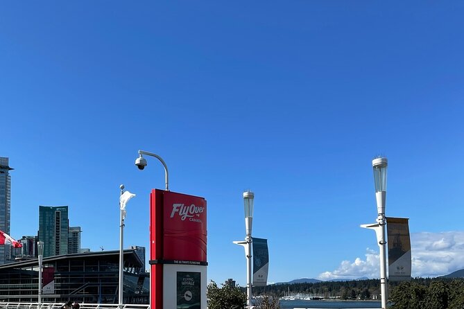 Flyover in Vancouver - The flight moves from peaks to coastal waters