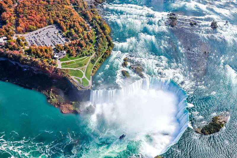 From Toronto: Niagara Falls Bus Tour with Boat Cruise - Journey Behind the Falls at 125 feet below ground
