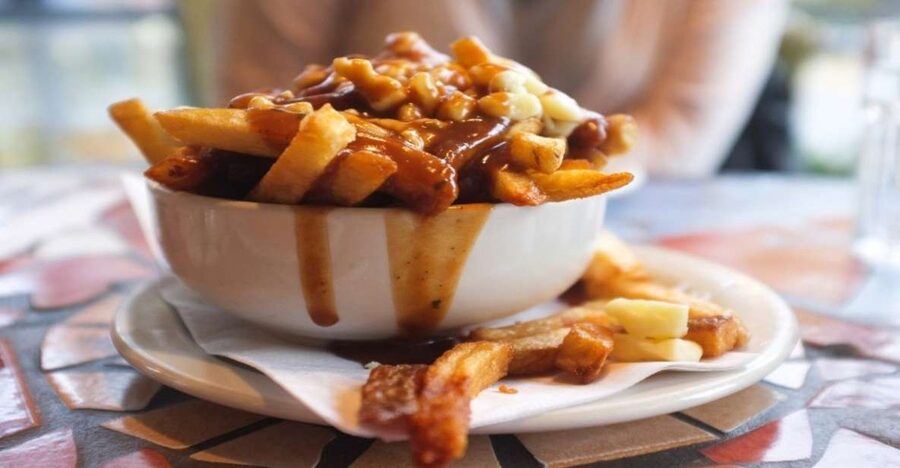Montreal: Best of Montreal Food Walking Tour with Tastings - Poutine brings the first serious portion