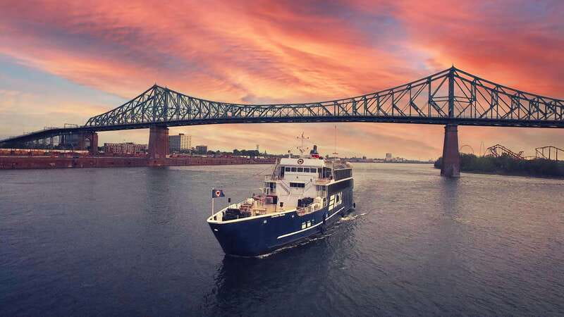 Montreal: Evening Cruise with DJ and Dance Floor - Jacques Cartier Bridge at sunset