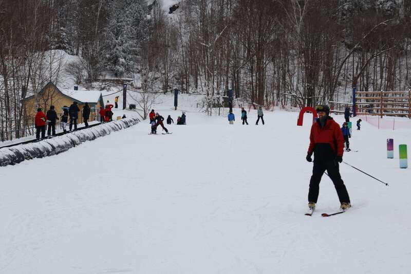 Montreal: Guided Skiing in Quebec Forests - Getting fitted with skis, a helmet, and winter gear