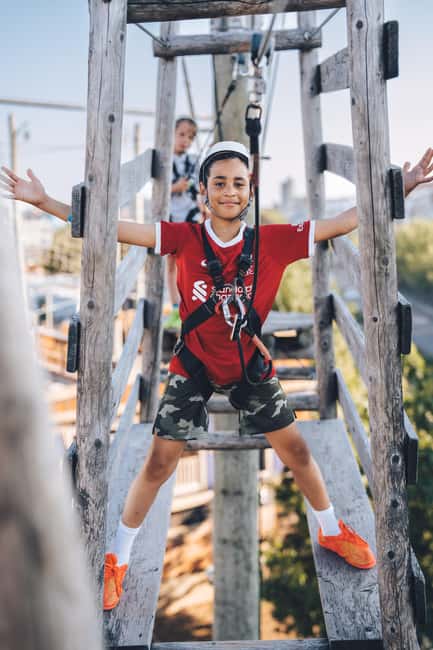 Montreal: Voiles En Voiles Aerial Park Admission Ticket - Beyond the ropes: inflatables, climbing, and the carousel