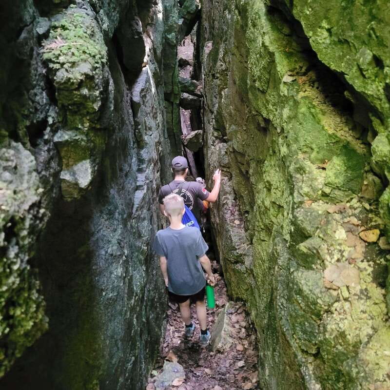 Private Nottawasaga Bluffs Caves Hike - Creemore/Collingwood - Apple trees, forest, and the first rocky passage