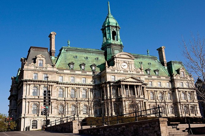 Semi-Private Old Montréal Walking Tour by Guidatour - A plaza filled with statues and monuments