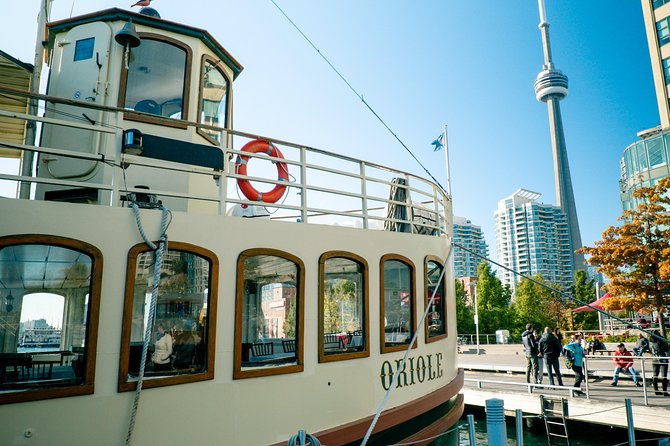 Toronto Premium Small Group Driving Tour with CN Tower - Pickup, group size, and the four-hour claim