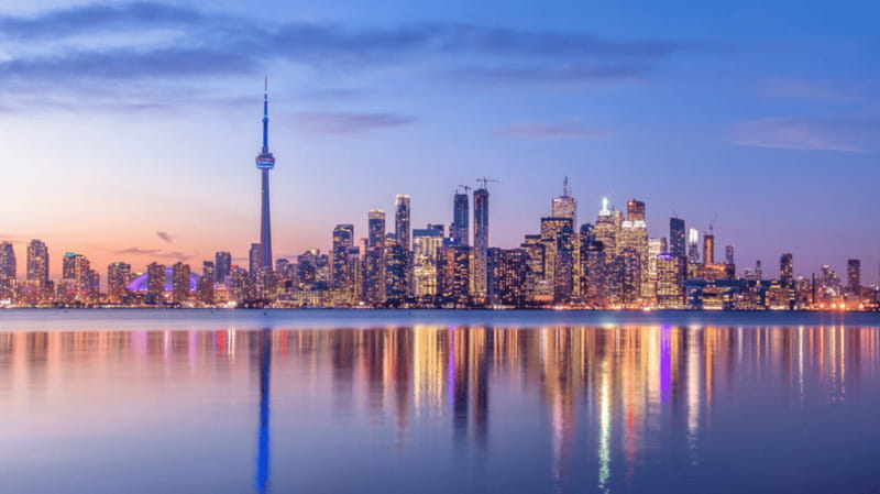 Toronto: Small Group Night Tour with Harbour Boat Cruise - Yonge-Dundas Square after dark